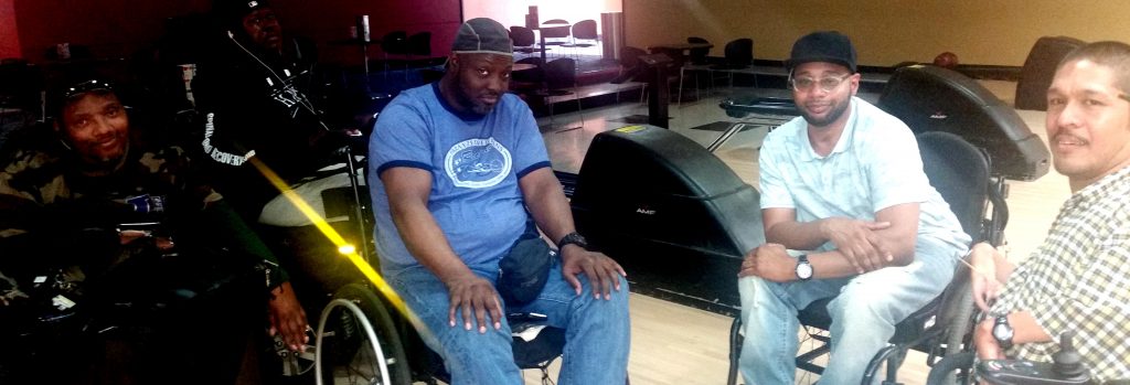 Men in wheelchairs at the gym
