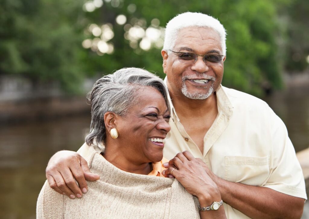 old black couple standing together smiling