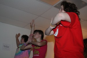 Teen girls during a "calming yoga" session during Girls Night Out 