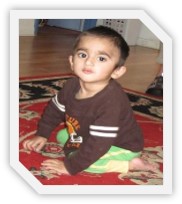 Abdurrahman sitting on the floor.