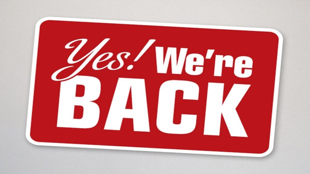 Sign that reads "Yes! We're BACK". 