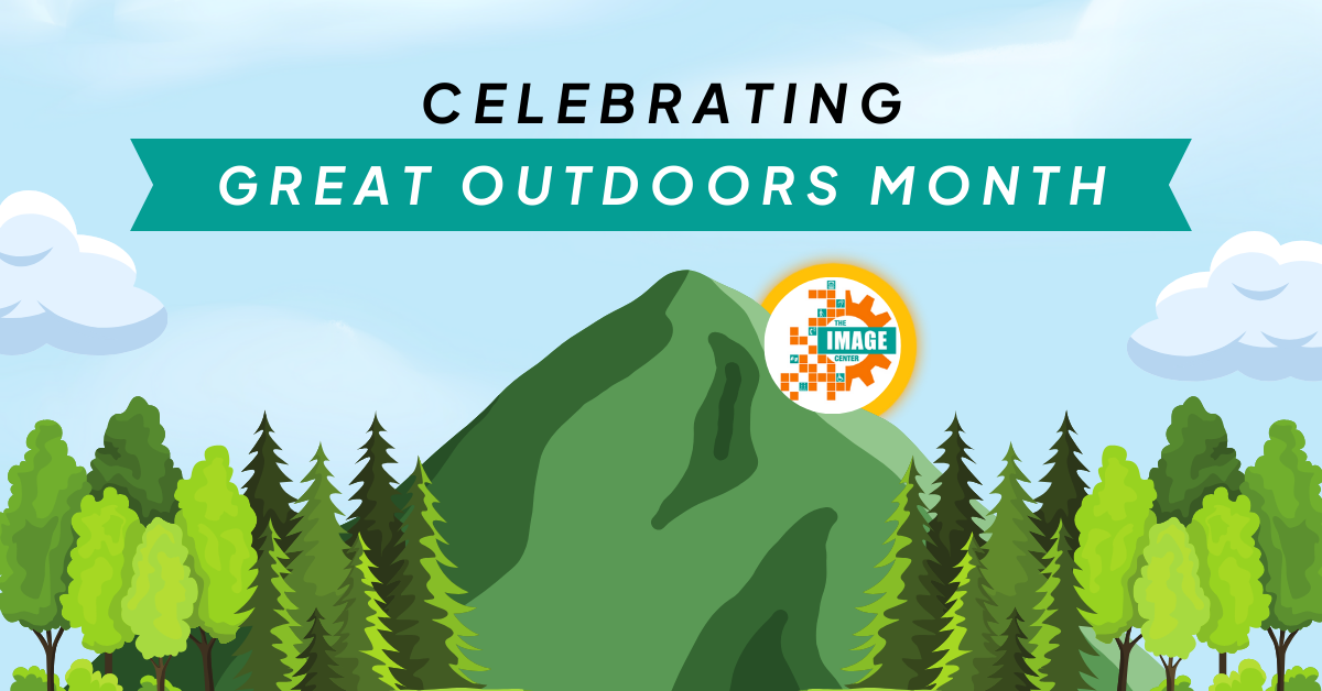 Big green mountains and forests, text at the top says 'celebrating Great Outdoors Month.'