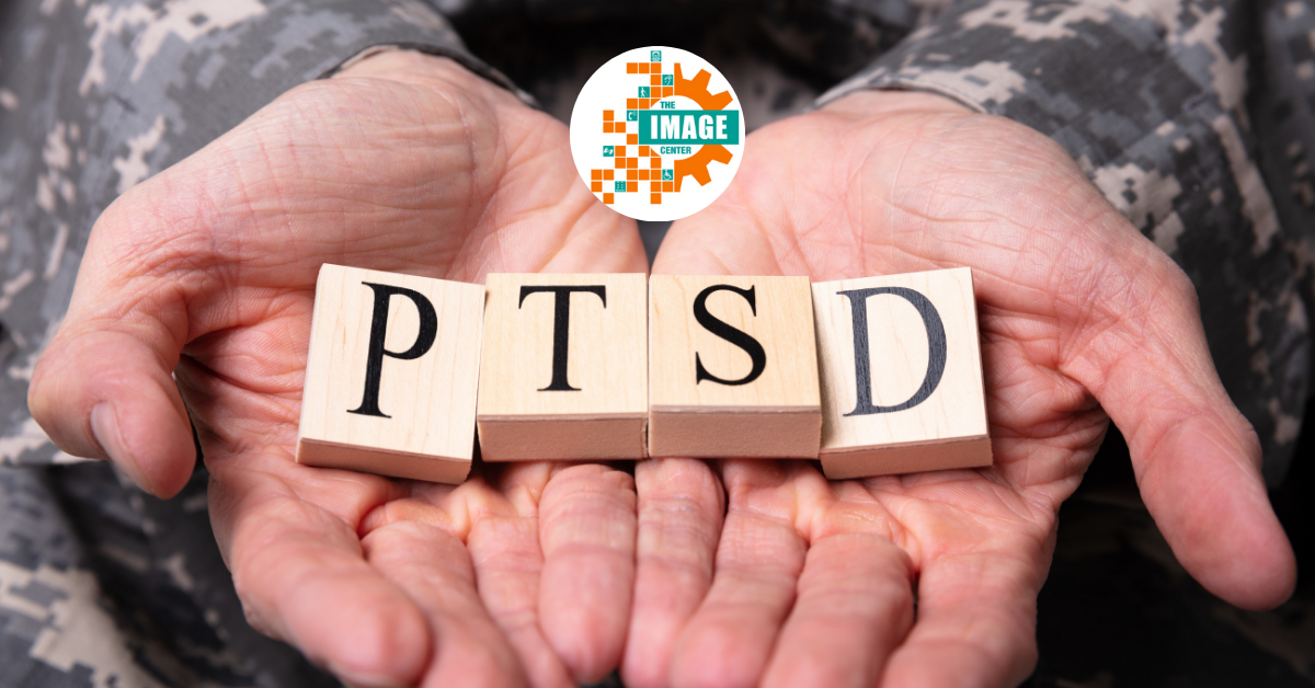 Close-up of male soldiers in military uniforms holding wooden cubes with "PTSD" text.
