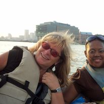 2 women smiling on a boat.