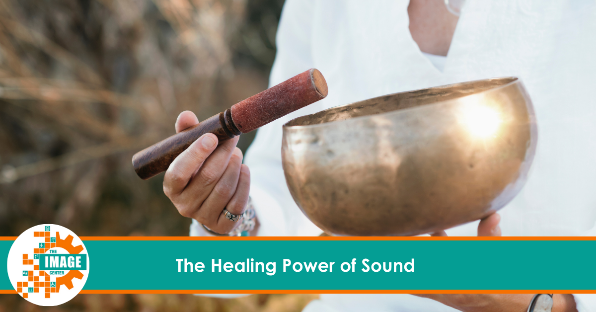 A person dressed in white is holding a singing bowl in one hand and a mallet in the other, preparing to create sound vibrations. The IMAGE Center logo is in the bottom left corner, with the text "The Healing Power of Sound" displayed across the bottom.